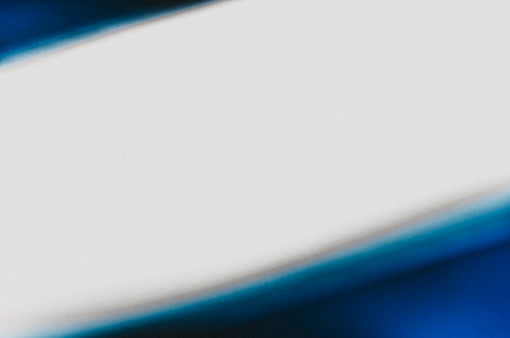 Exposure and Response Prevention (ERP) Therapy 1 Abstract photograph of an ambiguous bright curved form against deep navy, its edges impossible to fully resolve